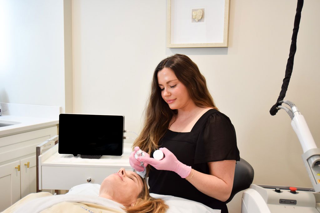 Woman receiving skin care chemical peel